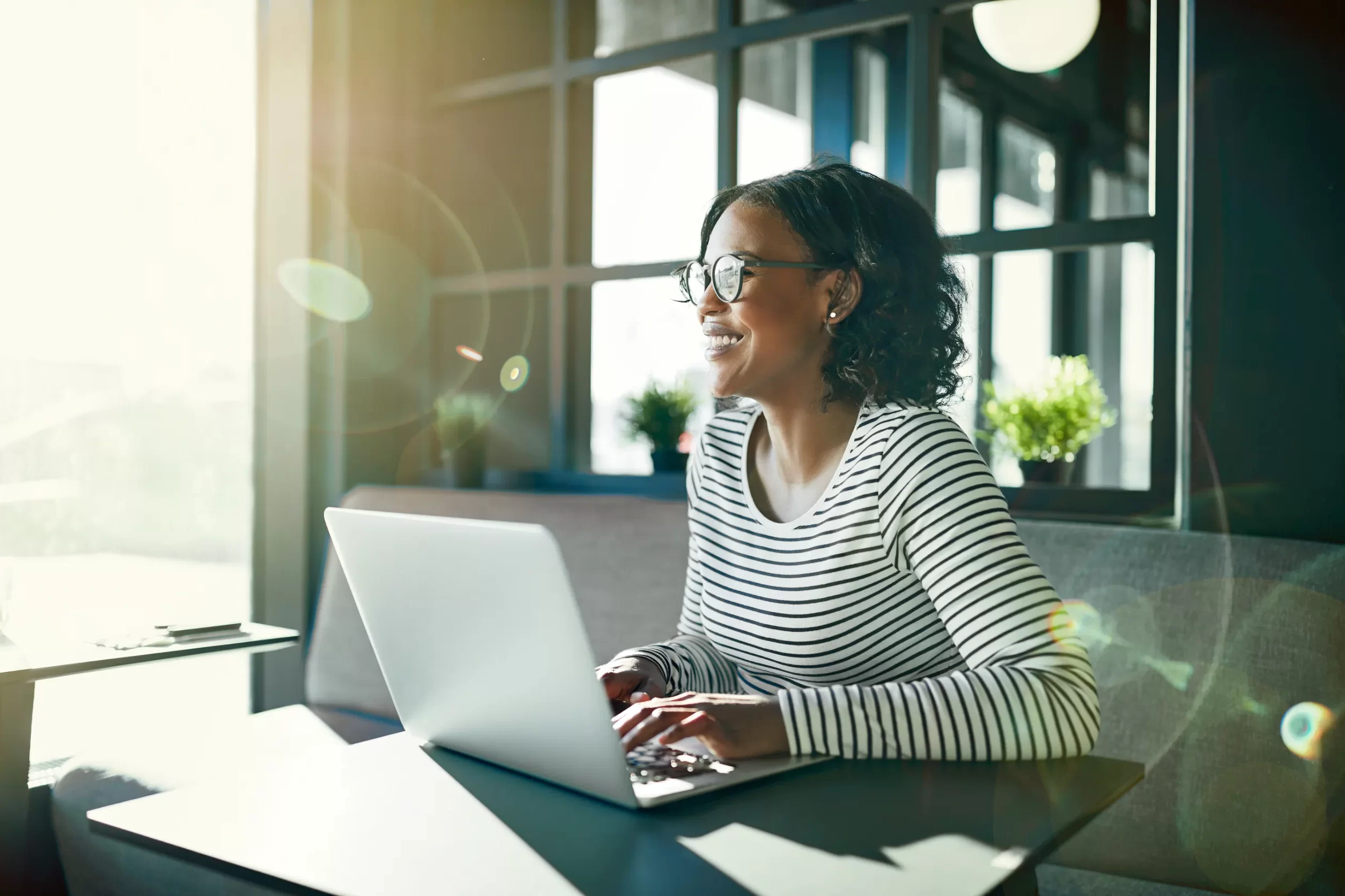 Woman smiling at laptop