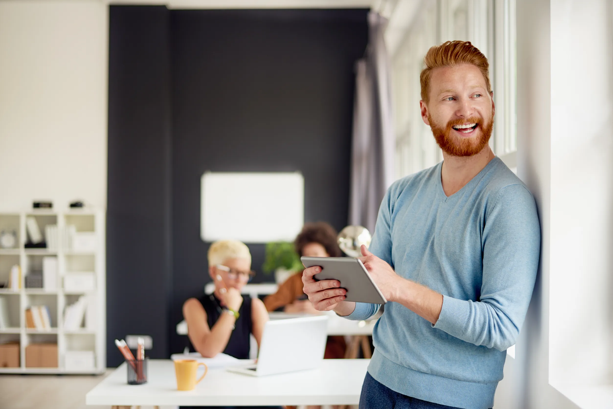 Man smiling with ipad