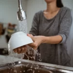 Woman washing dishes