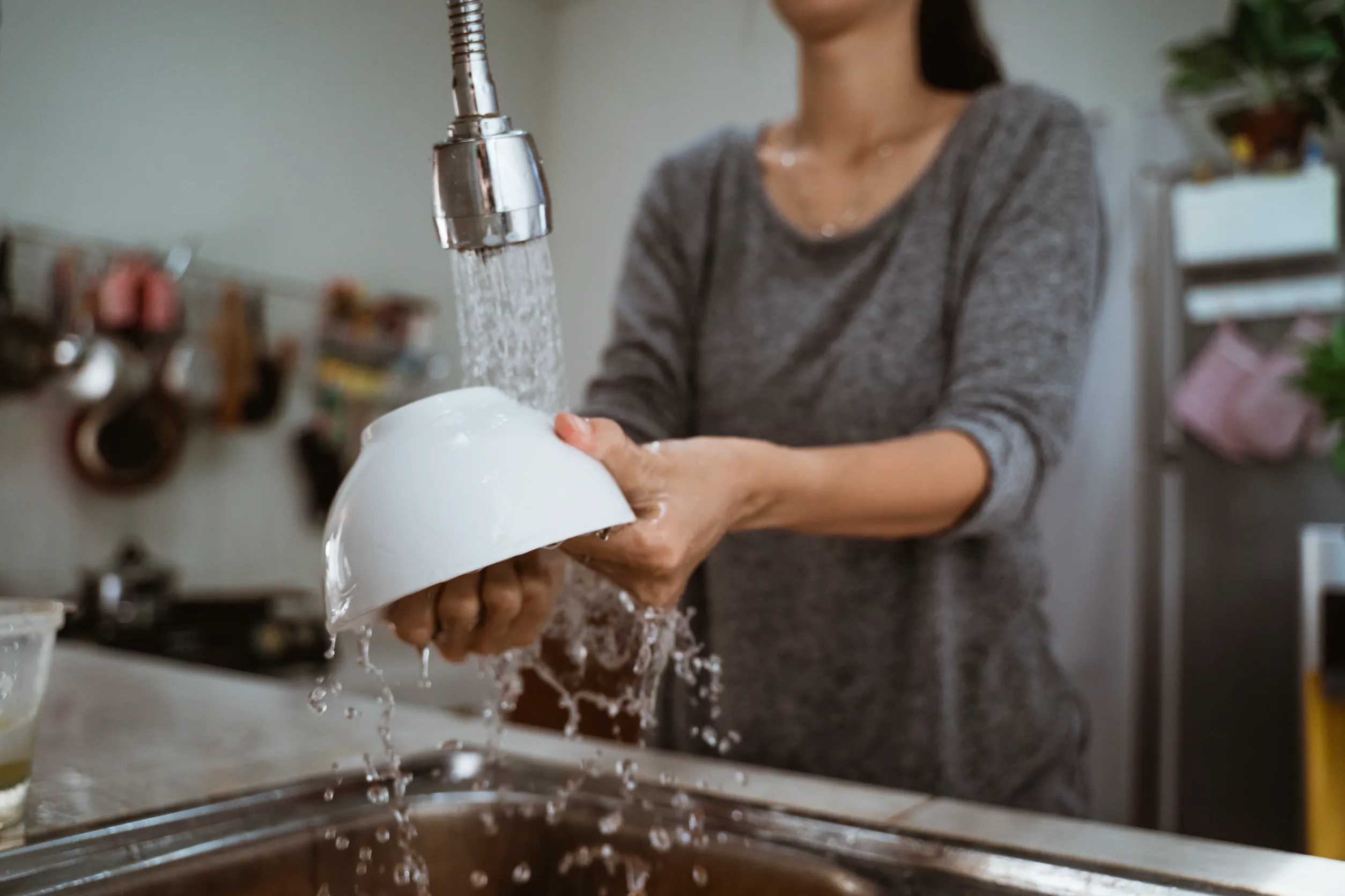 Woman washing dishes