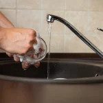 Person washing a cup