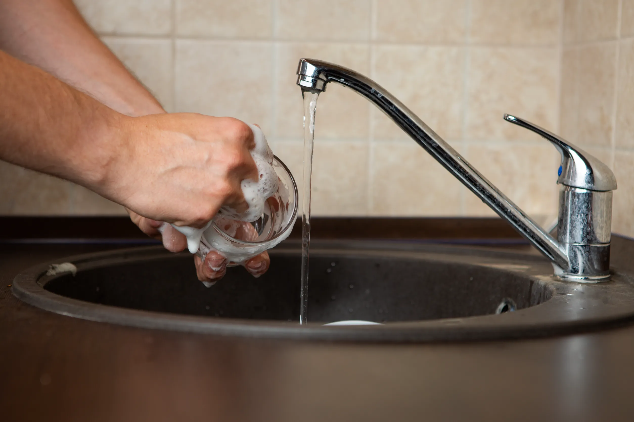 Person washing a cup