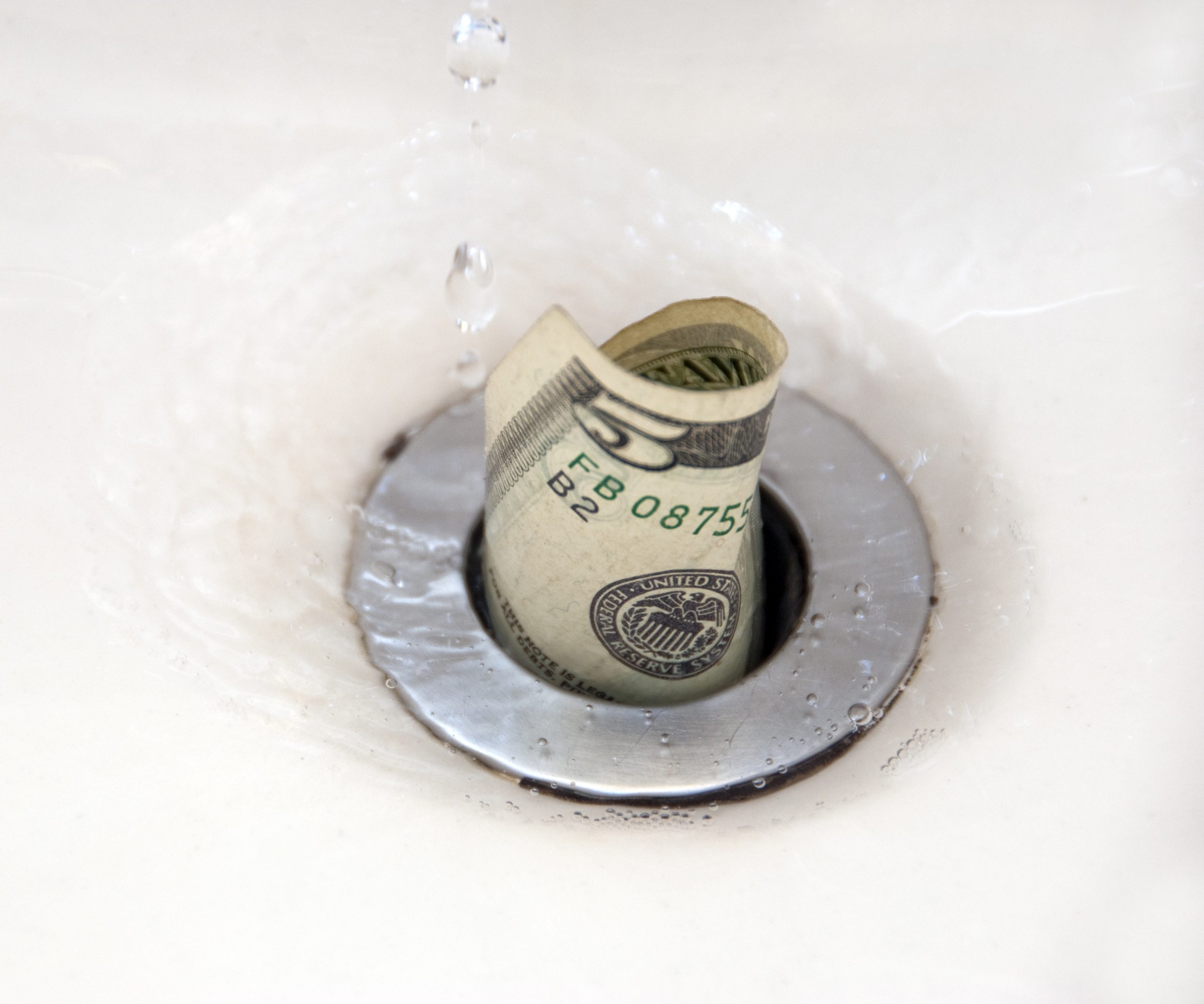 $5 bill going down the drain