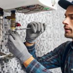 Plumbing professional working on a tankless water heater